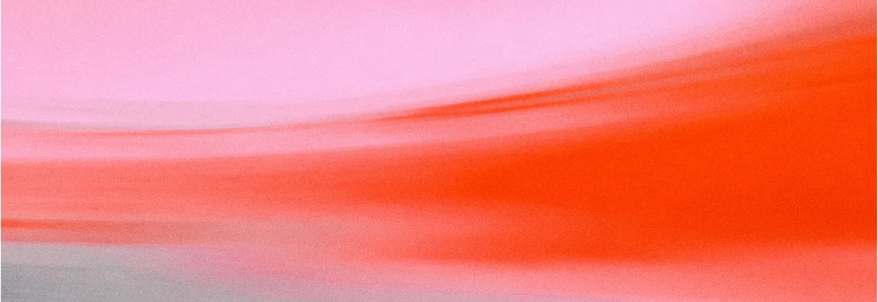 Motion-blurred streaks of pink and bright orange-red sweeping upwards from left to right, fading into grey at the lower edge